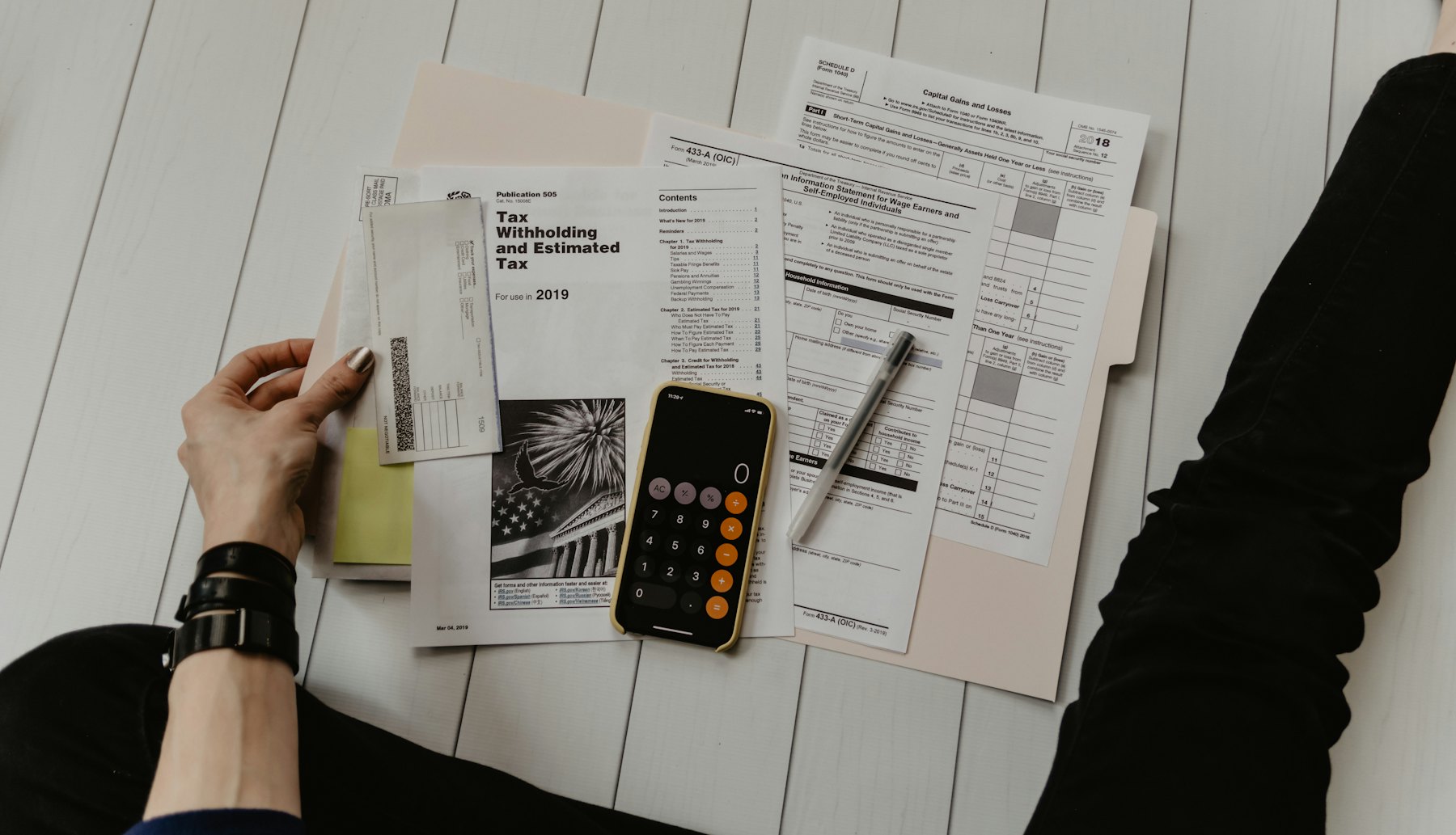A close up of a healthcare bill and a calculator on a desk